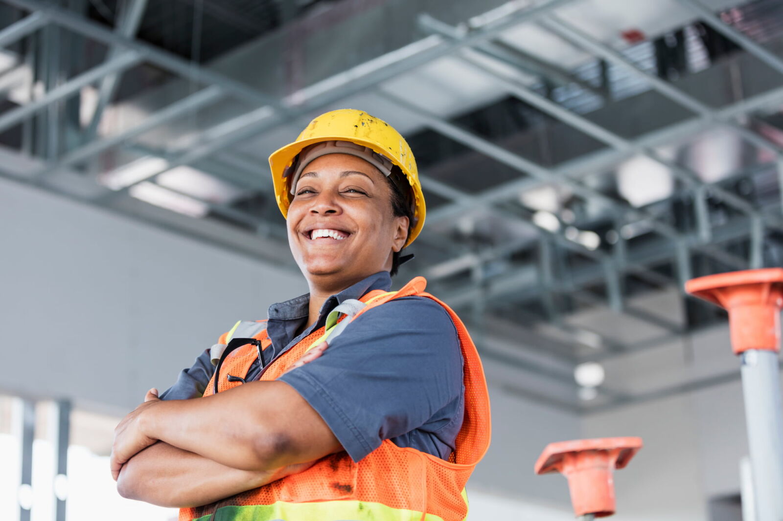 woman in safety gear with arms folded