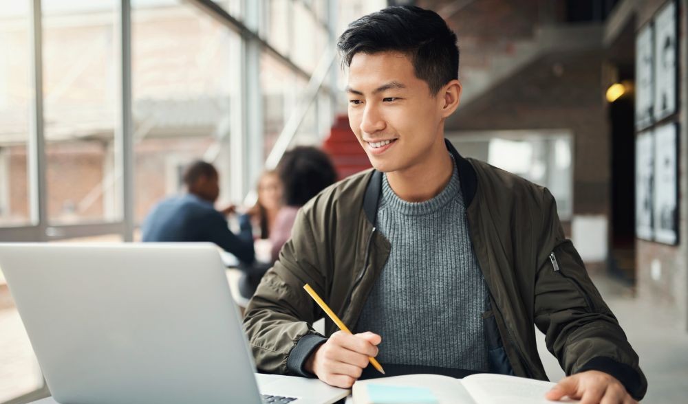 Student researching energy education programs online