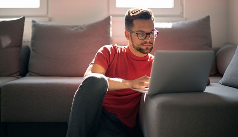 Student researching energy scholarships and career opportunities on a laptop